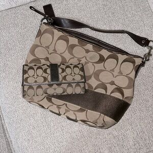 Coach bag with wallet. I’m selling both bag and wallet it has small stain .